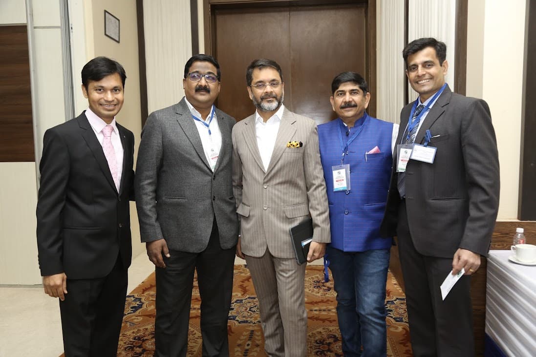 Professionals posing together at a formal business gathering