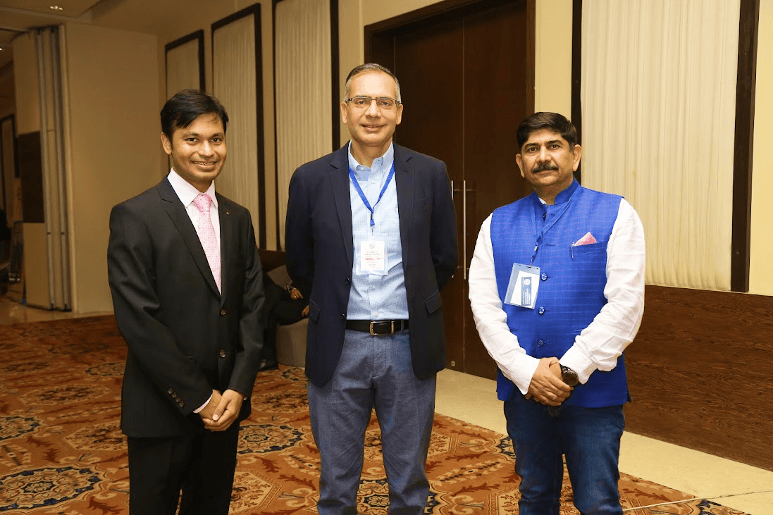 Three professionals standing together during a UNNITEE gathering
