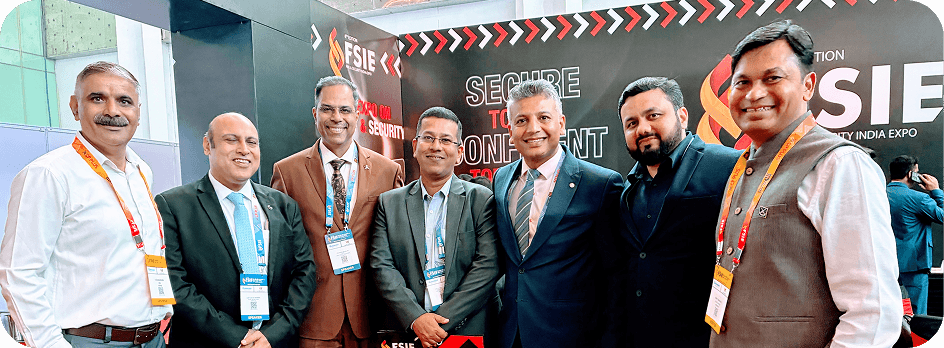 Curated event attendees standing together at a conference booth