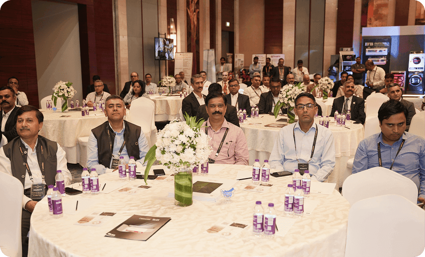 Three unnitee attendees posing for a selfie at an indoor event